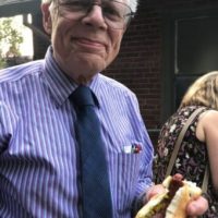 Eric Norberg holding hotdog