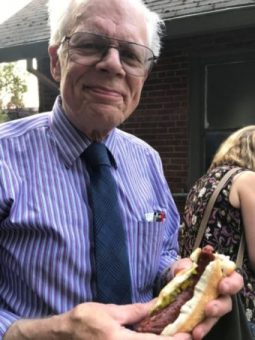 Eric Norberg holding hotdog